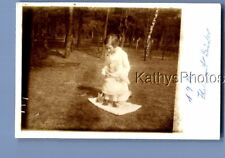 REAL PHOTO RPPC A_6660 WOMAN IN DRESS KNEELING HOLDING BABY picture