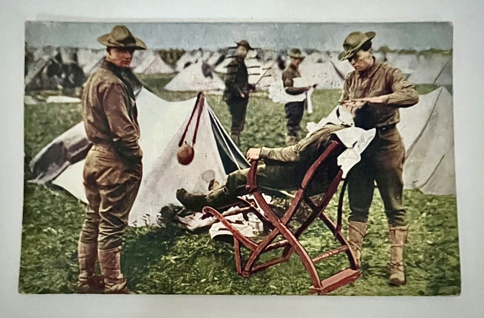 WW1 1916 ANTIQUE POSTCARD In the Field ARMY Wounded Soldier COMBAT Uniform RPPC