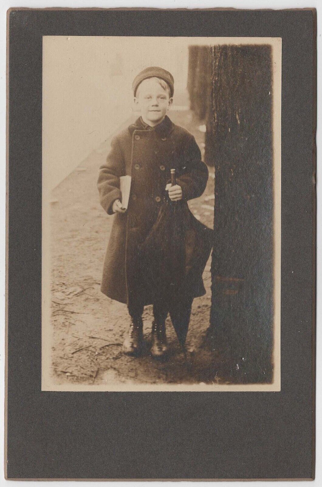CIRCA 1900s CABINET CARD YOUNG SCHOOL BOY HOLDING BOOK AND UMBRELLA OUTSIDE