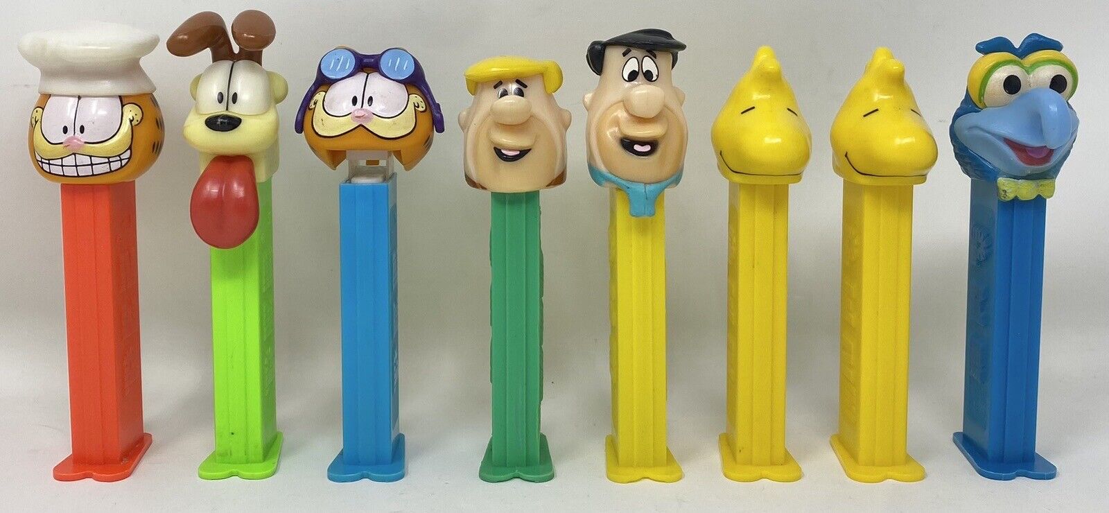 Mixed Lot of 8 Garfield Flintstones Gonzo Muppet Woodstock PEZ Candy Dispensers
