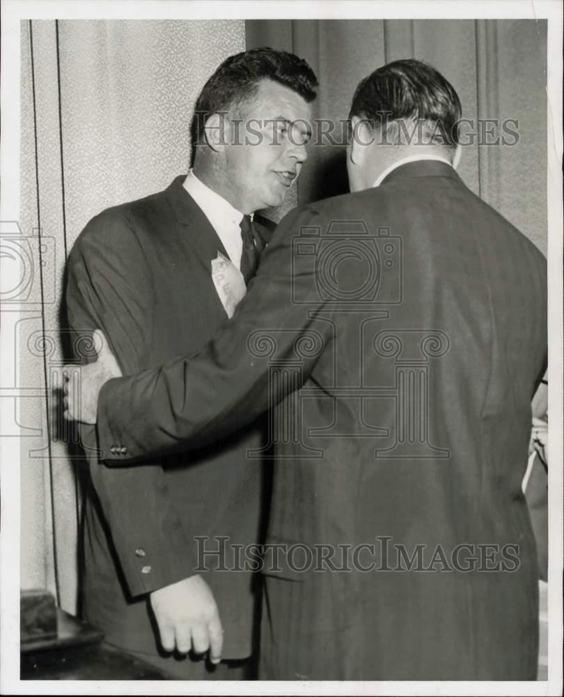 1958 Press Photo John Thomson tries to quiet John McDonough during a meeting