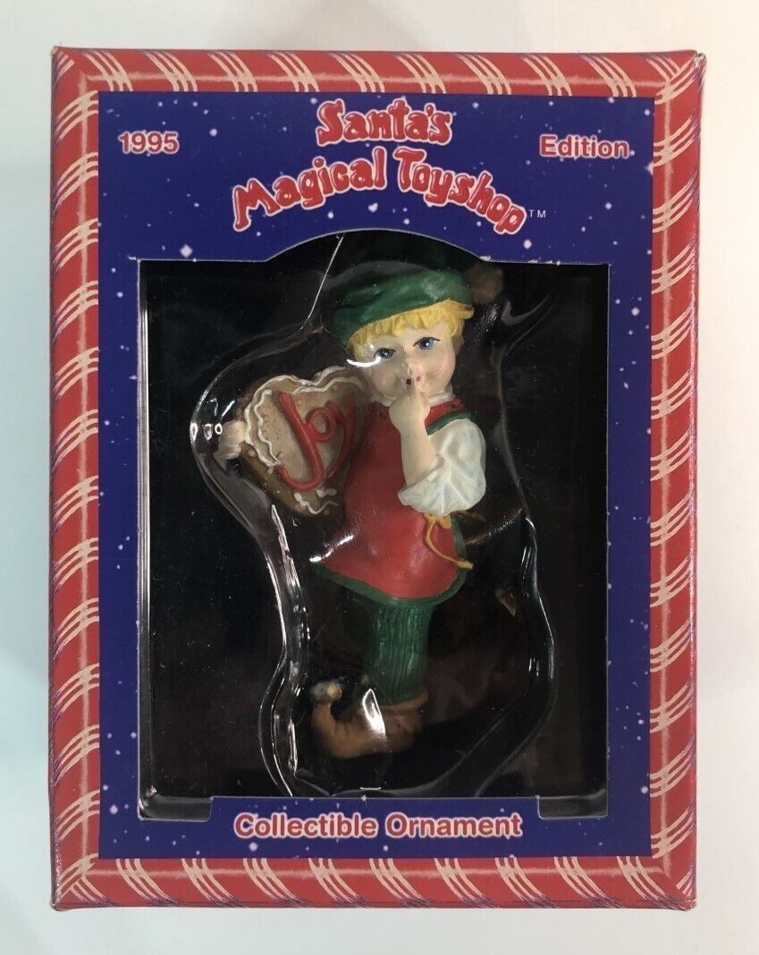1995 Santa\'s Magical Toy Shop Christmas Ornament Elf Holding a Cookie with Joy