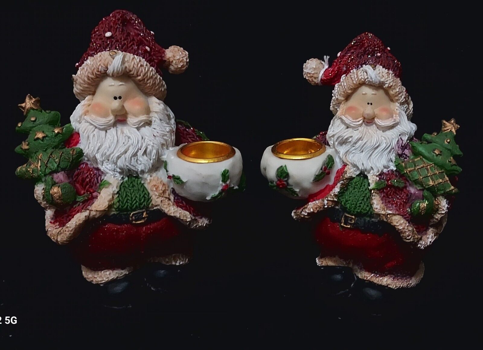 Pair of Santa Claus candlestick holders
