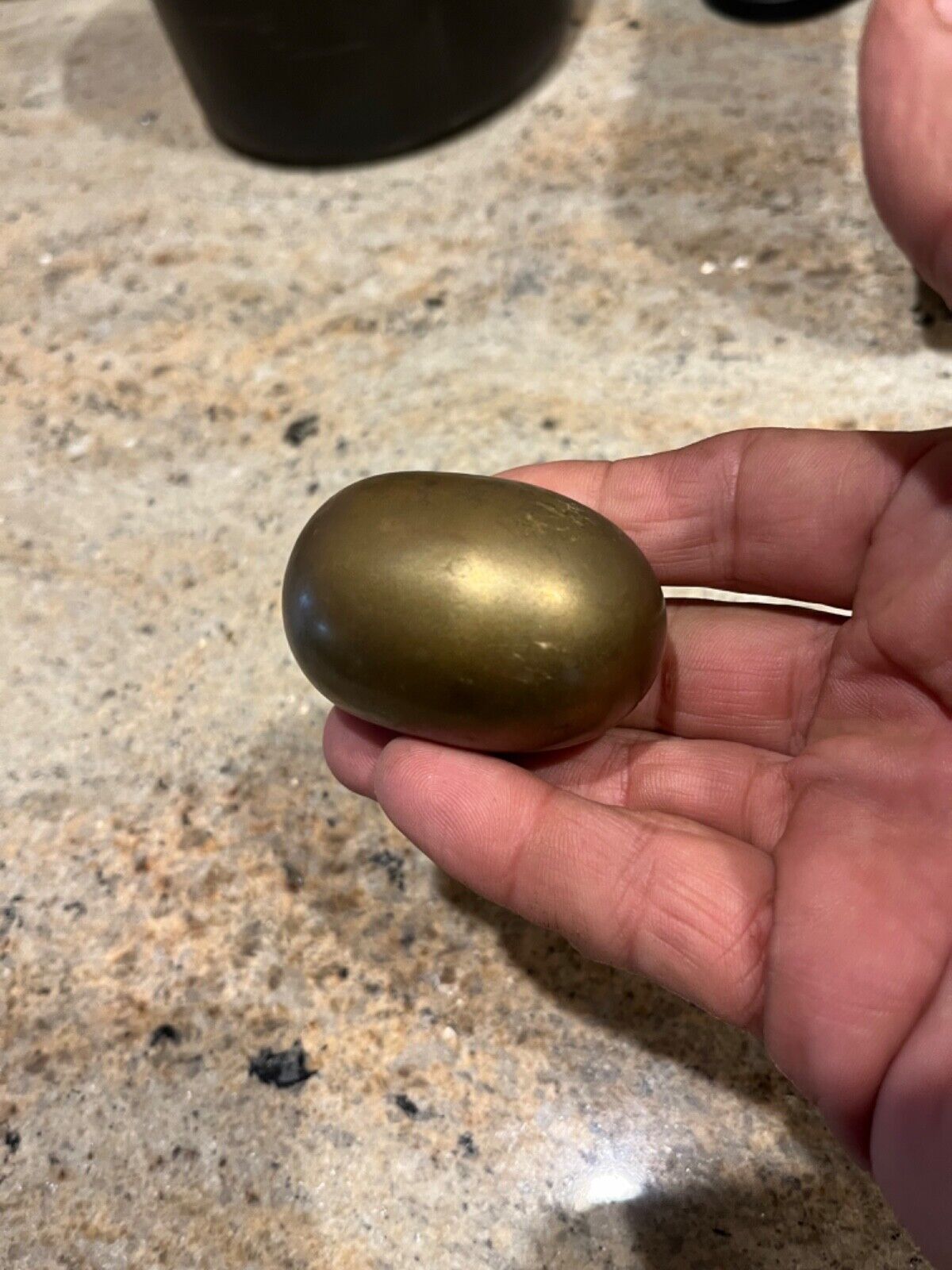 unusual, solid, brass egg shaped paperweight