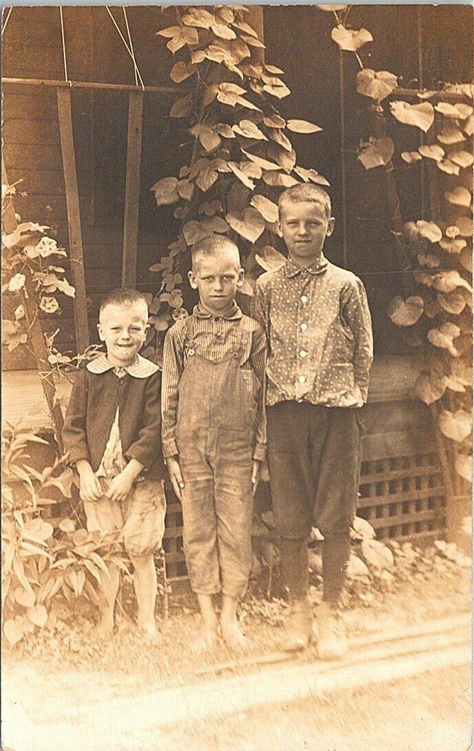 RPPC Poverty Scene - Three Boys (Two Barefoot) 1913