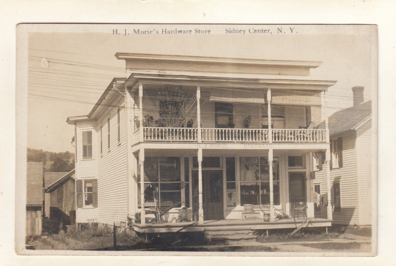 RPPC EXTERIOR of M. J. MORE\'S HARDWARE STORE in SIDNEY CENTER N  DELAWARE COUNTY