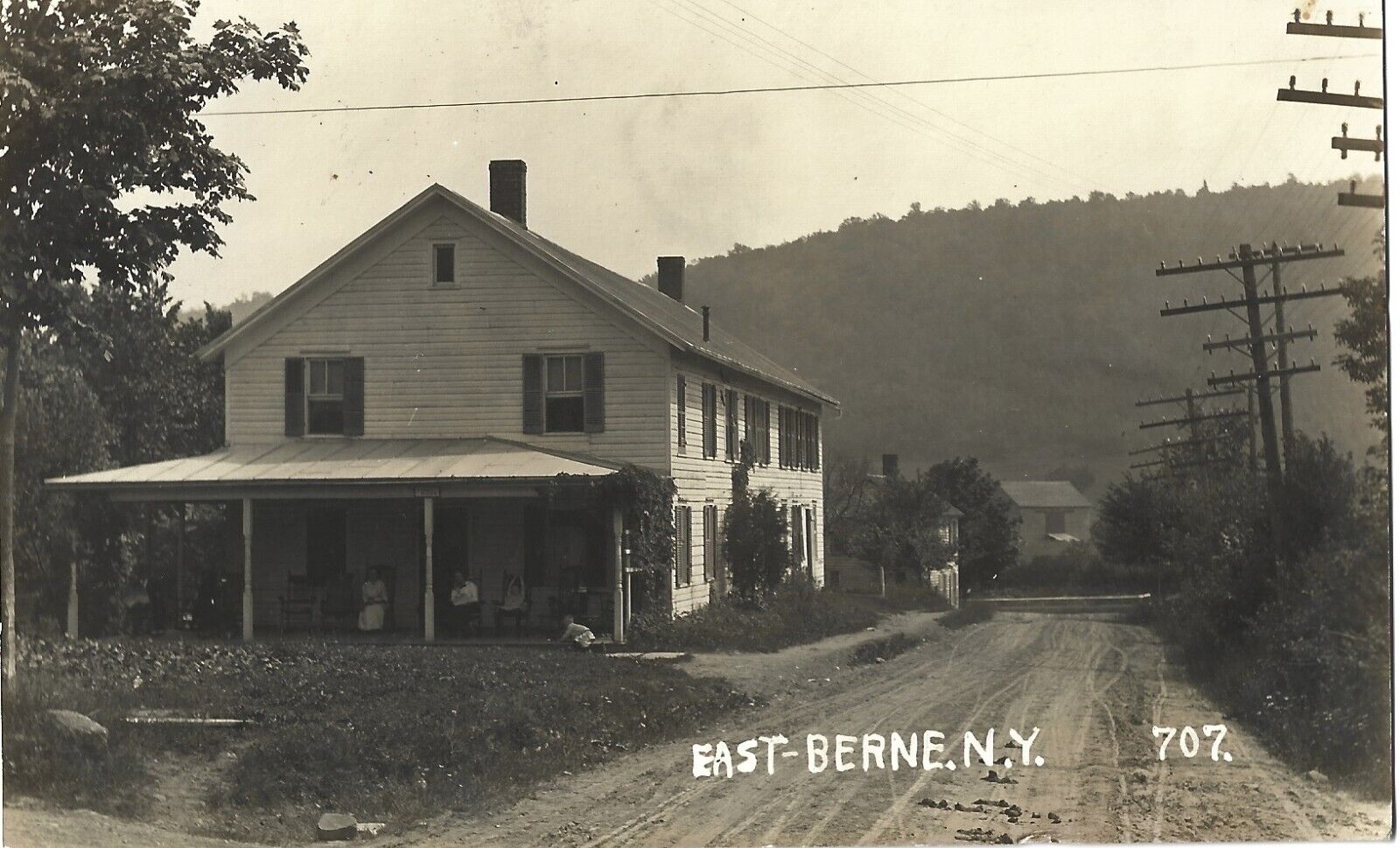Family on porch, dusty dirt road, East Berne NY; nice 1914 RPPC