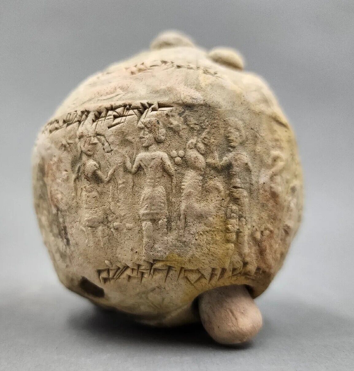 CIRCA NEAR EASTERN CUNEIFORM CLAY BALL GAME WITH WRITINGS AND SEALS. IMPORTANT
