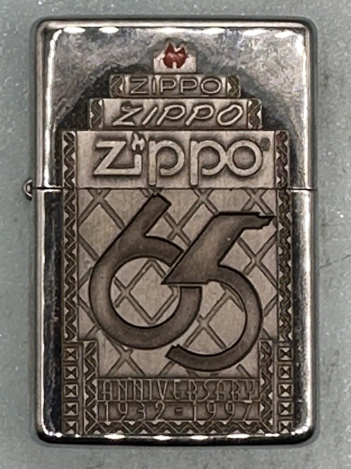 Vintage 1997 Zippo 65th Anniversary Emblem Chrome Zippo Lighter NEW