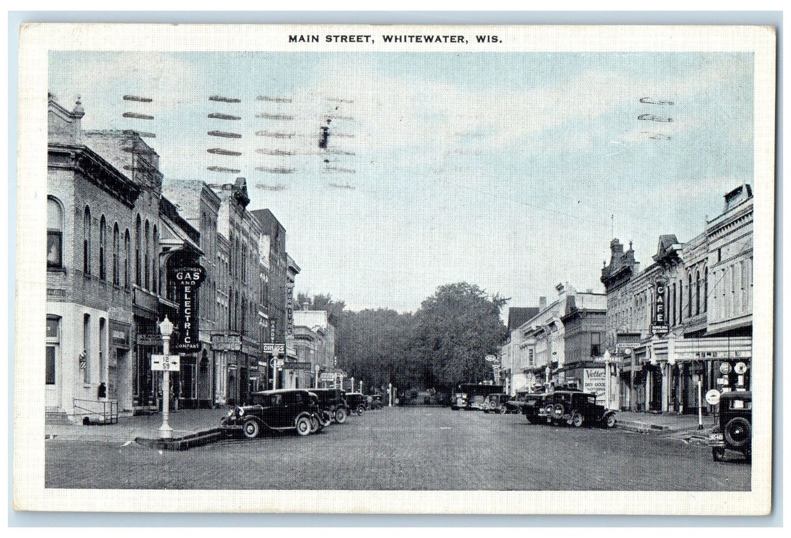 1939 Main Street Buildings Shops Cars Scene Whitewater Wisconsin WI Postcard