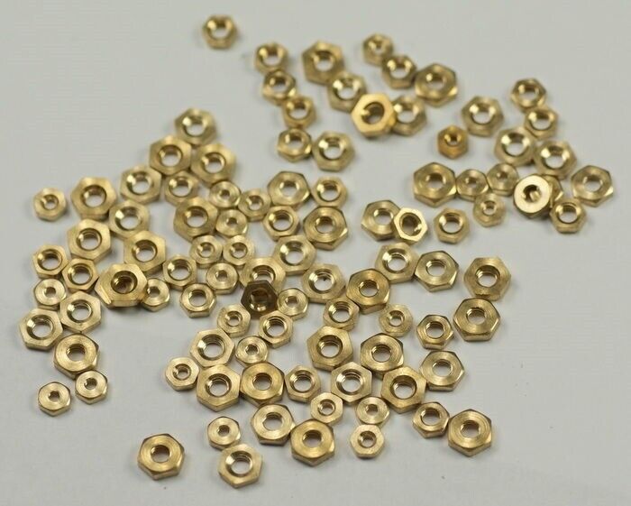 100 BRASS CLOCK NUTS ASSORTED clockmakers parts spares repairs 3-7mm movement
