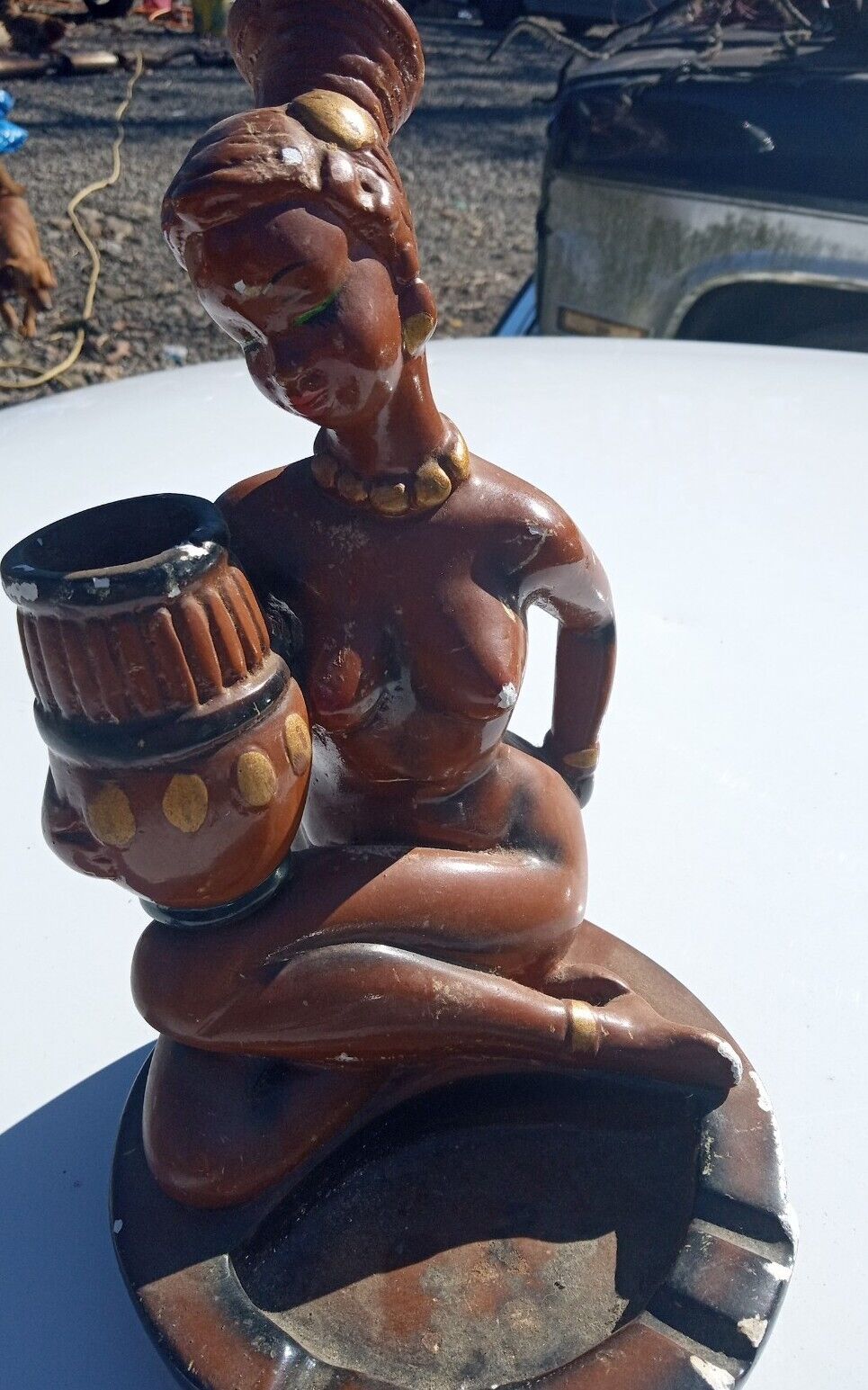 Vintage African woman holding jug sitting on an ashtray            very rare