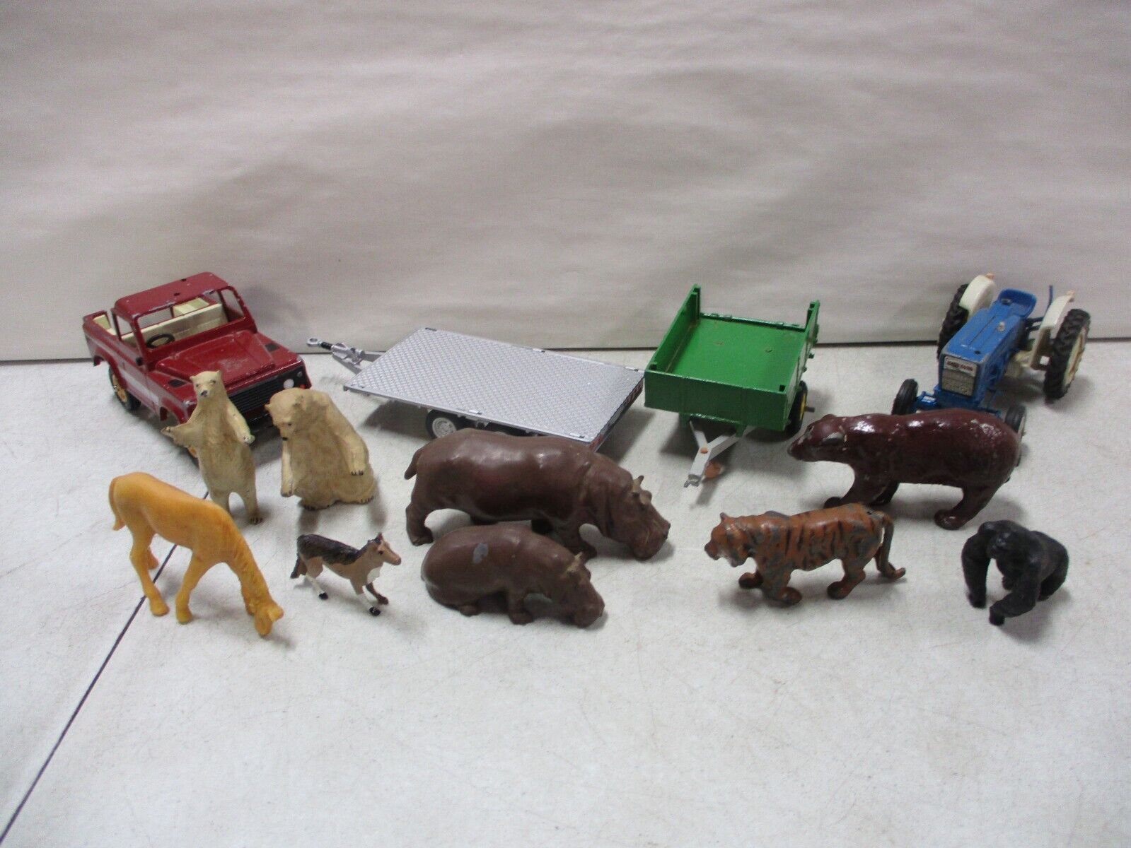 Britains Assorted lot with Trailers, Animals, Tractor, and Land Rover