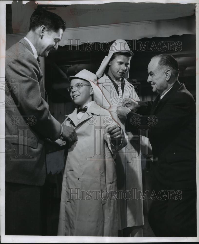 1957 Press Photo Dr. B.L. Corbett presents cadets with raincoats and hoods