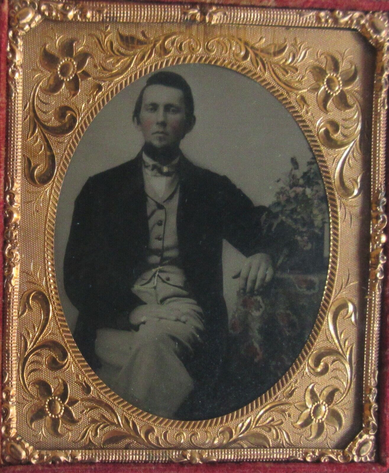 MAN SEATED AT TABLE. LOVELY TINTED 6TH PLATE AMBROTYPE, FULL CASE.