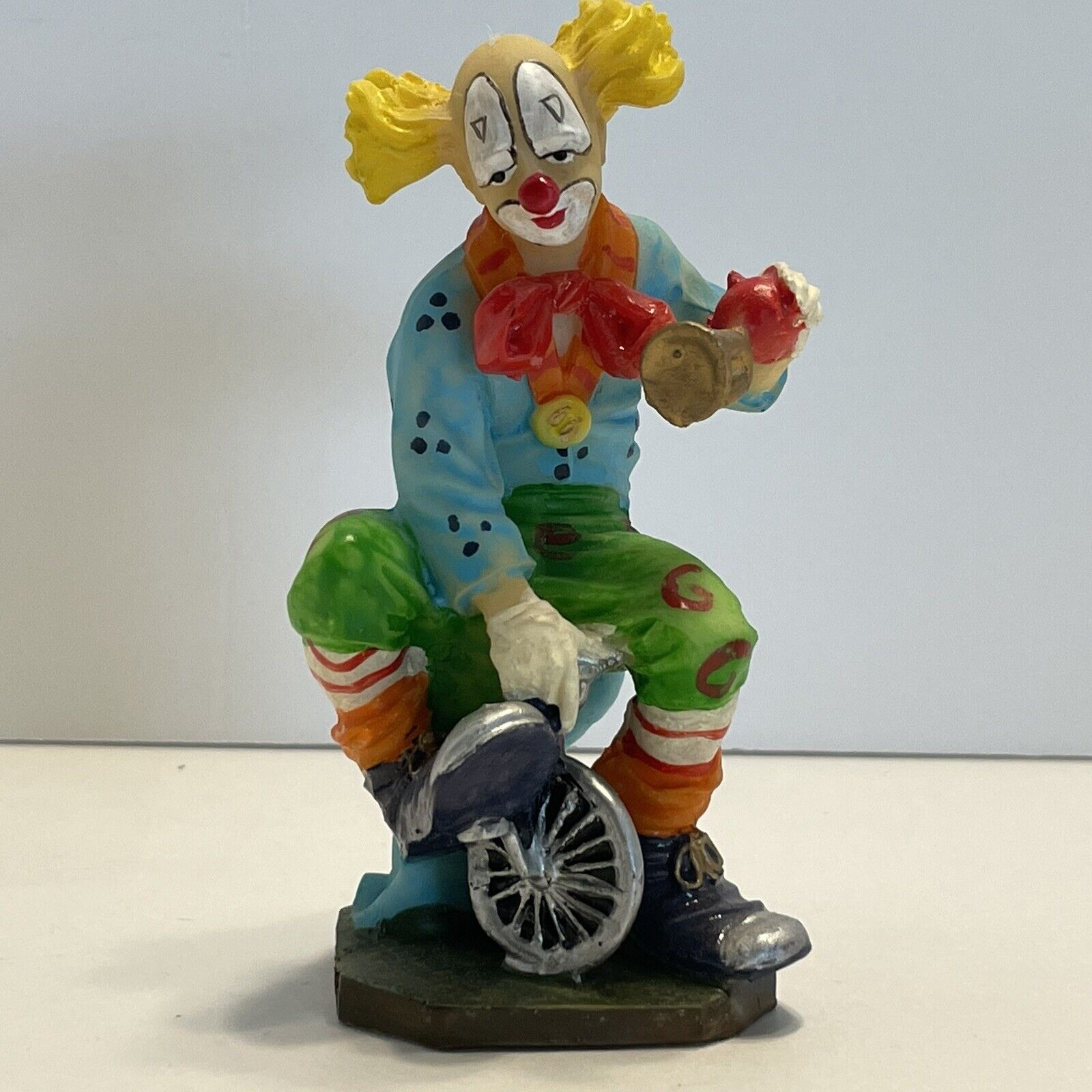 Vintage Satis-5 Ceramic Circus Clown on Tiny Bicycle Figurine Yellow Hair