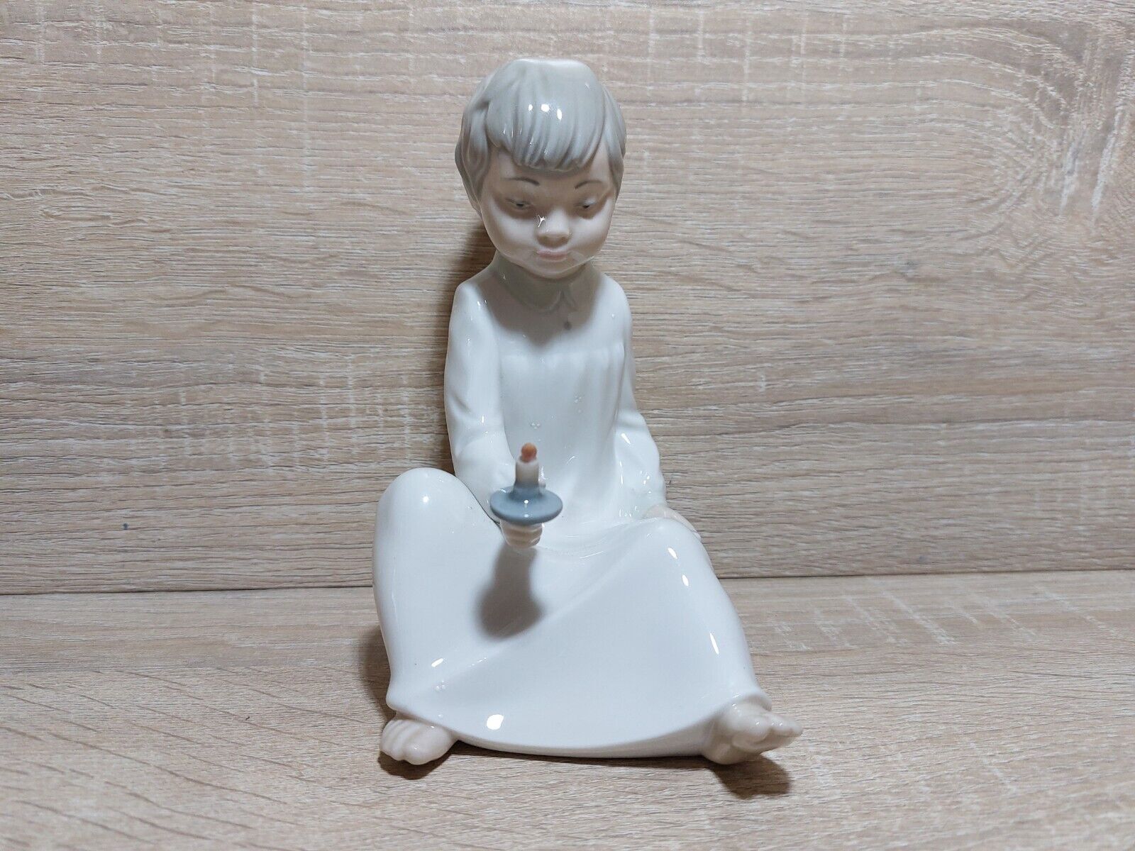 Zaphir Lladro Boy sitting down holding a candle Gloss Finish