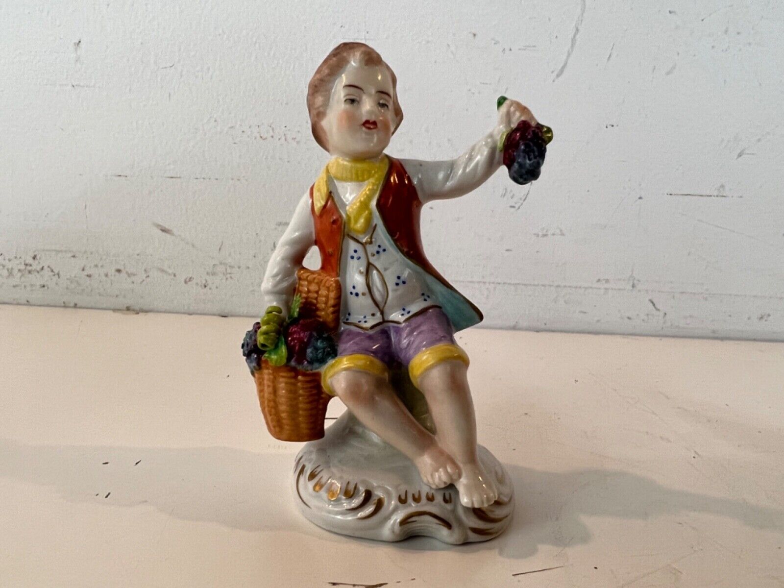 Vintage Early 20th Century Sitzendorf Porcelain Seated Boy with Grapes Figurine