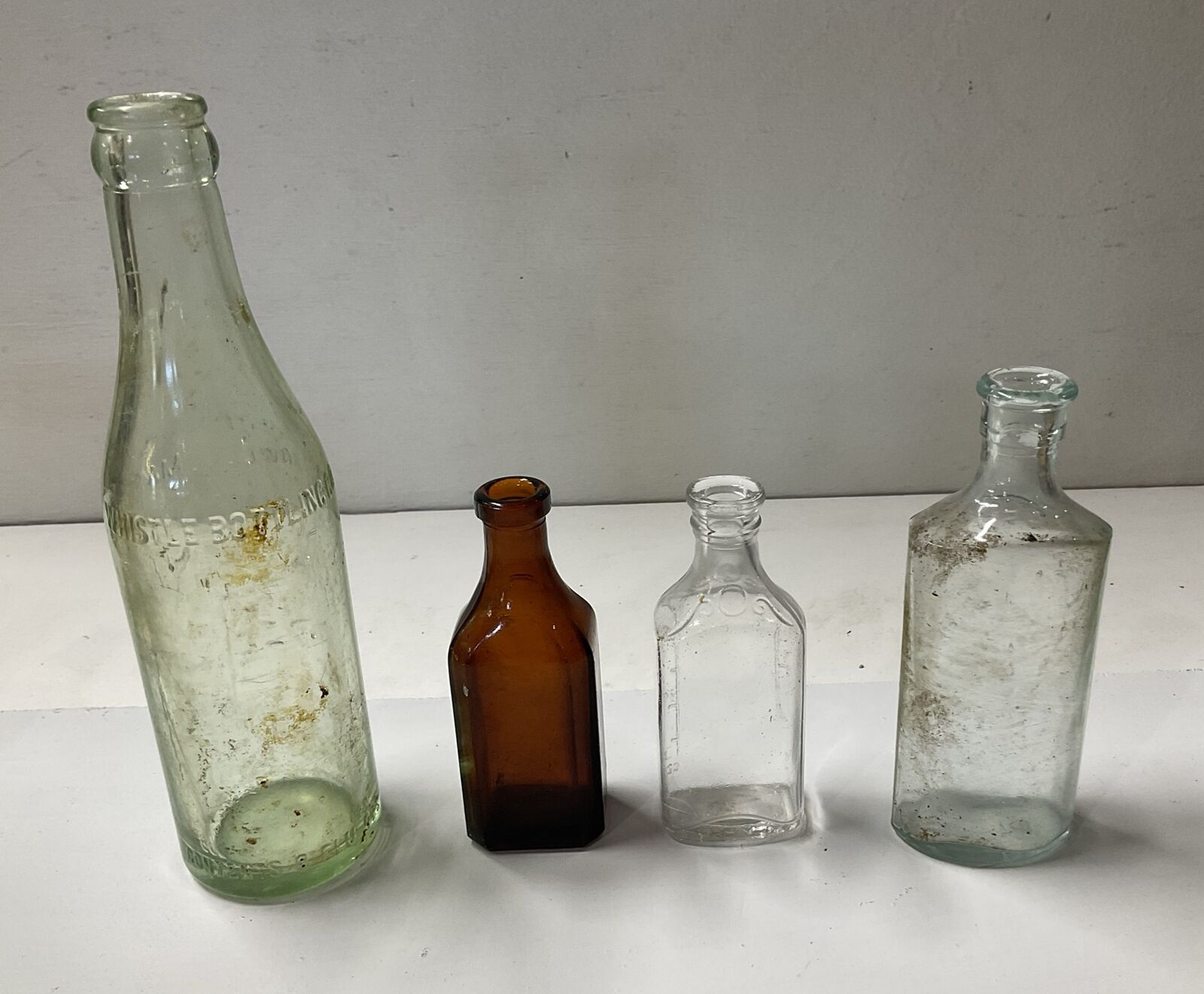 4 Antique Bottles. Whistle, Burnett, Lyric