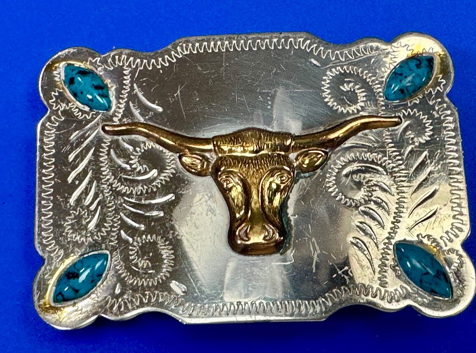 The Longhorn cow steer western nickel silver belt buckle with turquoise accents