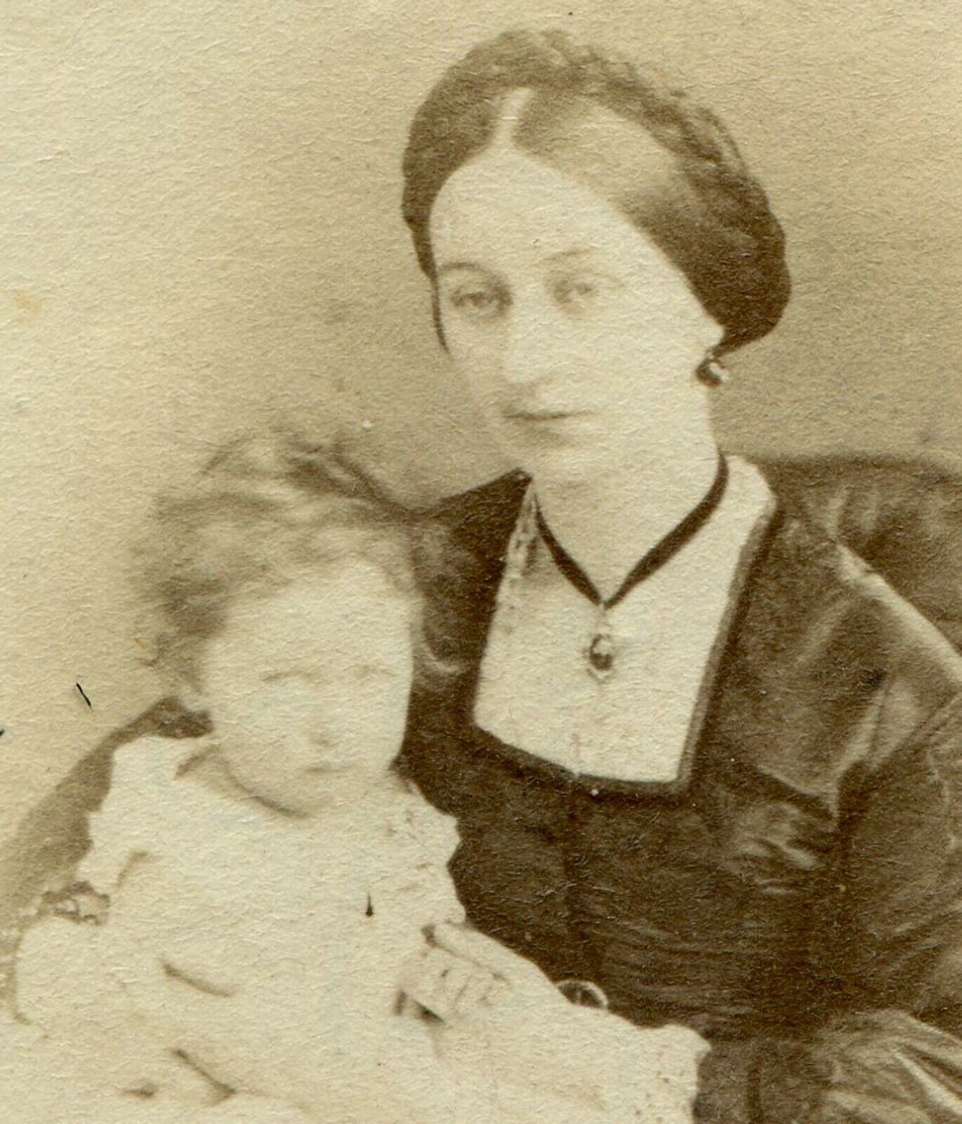 DAZED LOOKING WOMAN HOLDING YOUNG CHILD. CDV. 