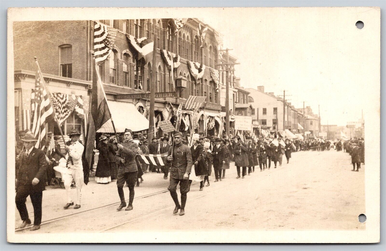 Postcard WW1 Parade? Military Soldiers Busy Street Scene (two holes) RPPC T110