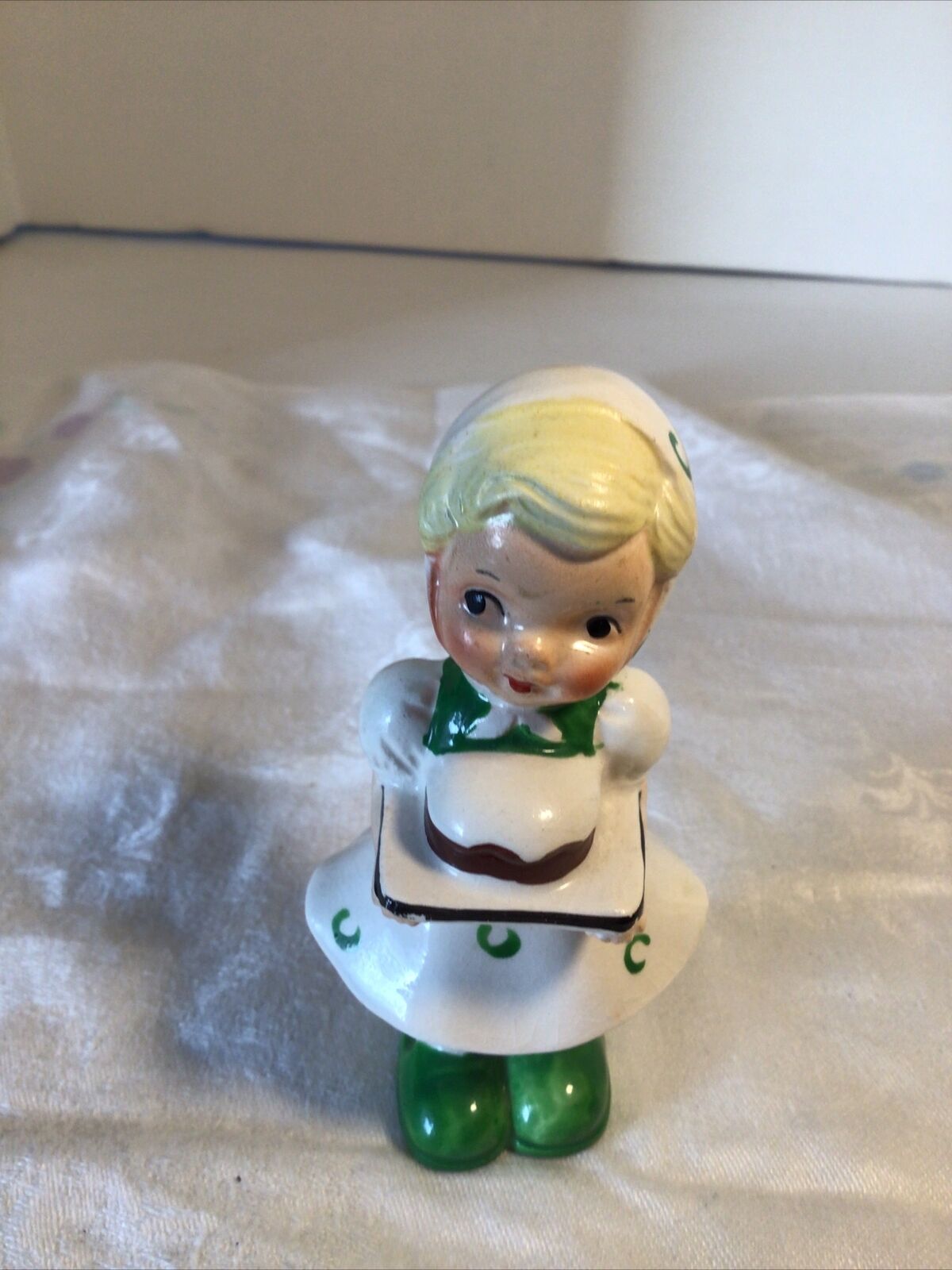 UCAGCO Figurine Girl, Ceramic, Japan, 4&1/4 Tall. Green Shoes Carrying A Cake.