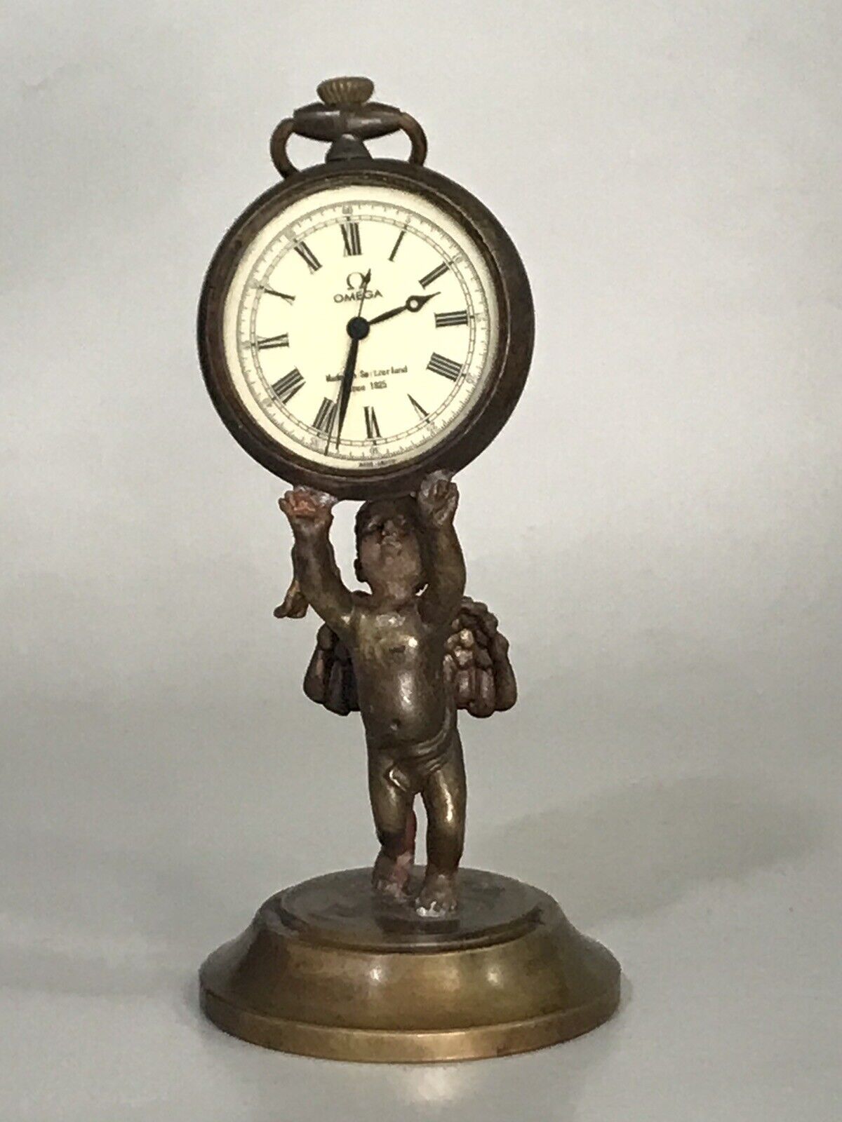 Antique Omega Style Pocket Watch Supported by Brass Winged Cherub 4.7” Tall