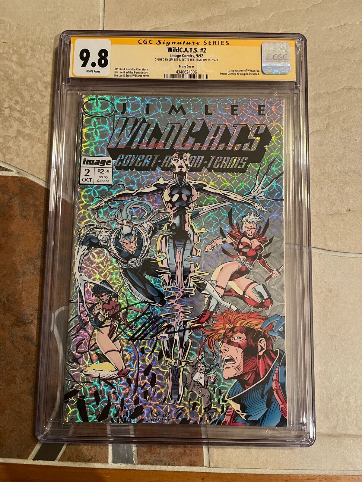 WildC.A.T.S. #2 CGC 9.8, SS X2 signed by Jim Lee +Scott Williams, prism variant