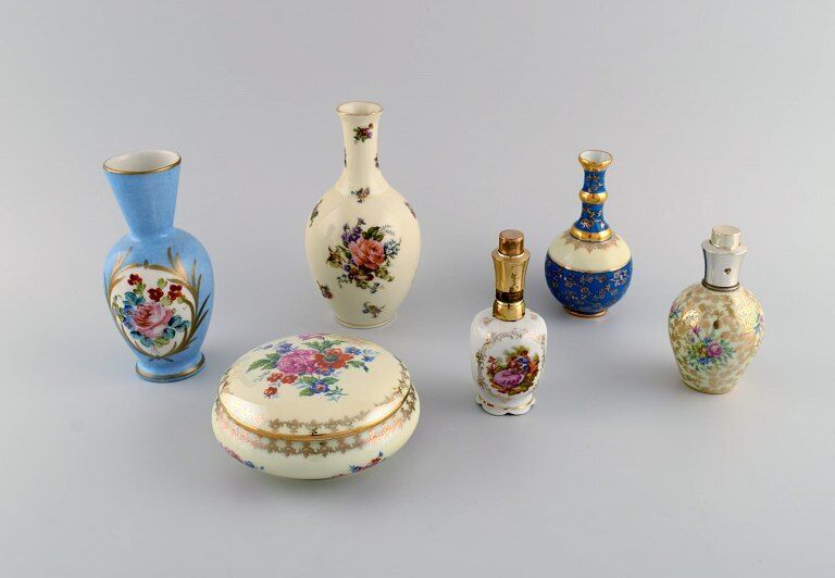 Limoges, France. Two perfume bottles, three vases and lidded box.