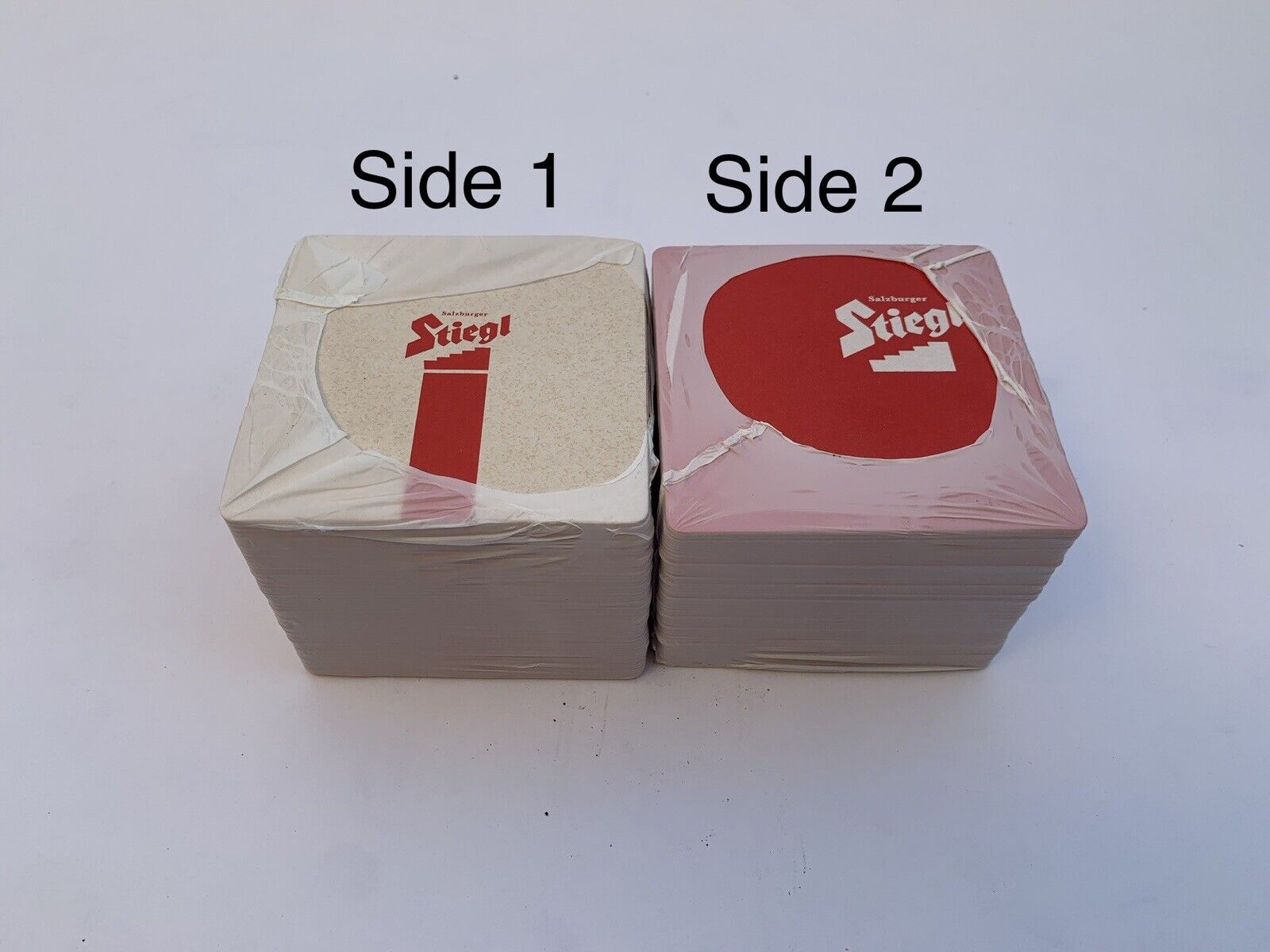 2 packs (100) Vintage STIEGL BIER AUSTRIA DOUBLE SIDED COASTERS Sealed Red White