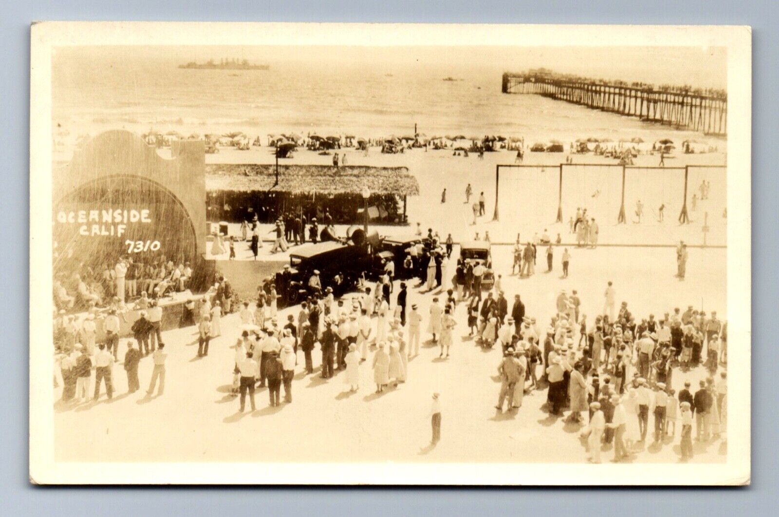 C.1910 RPPC BUSY BEACH at OCEANSIDE, CA, PERFORMANCE CARS SHIP PIER Postcard P3D