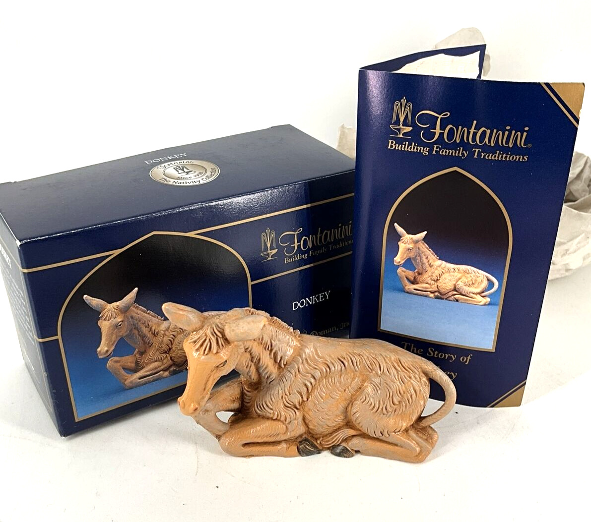 The Fontanini Heirloom Collection Nativity Figurine 5” Seated Donkey with Box