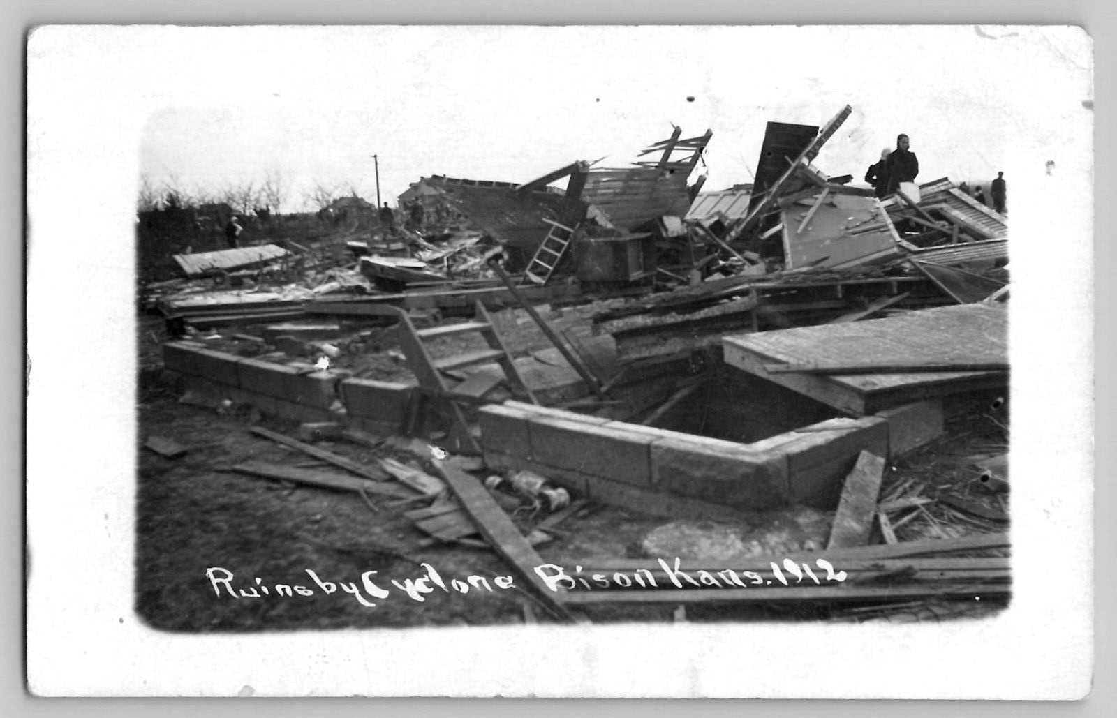 Ruins by Tornado Cyclone Bison KS 1912 RPPC Postcard Destroyed Homes Men Search