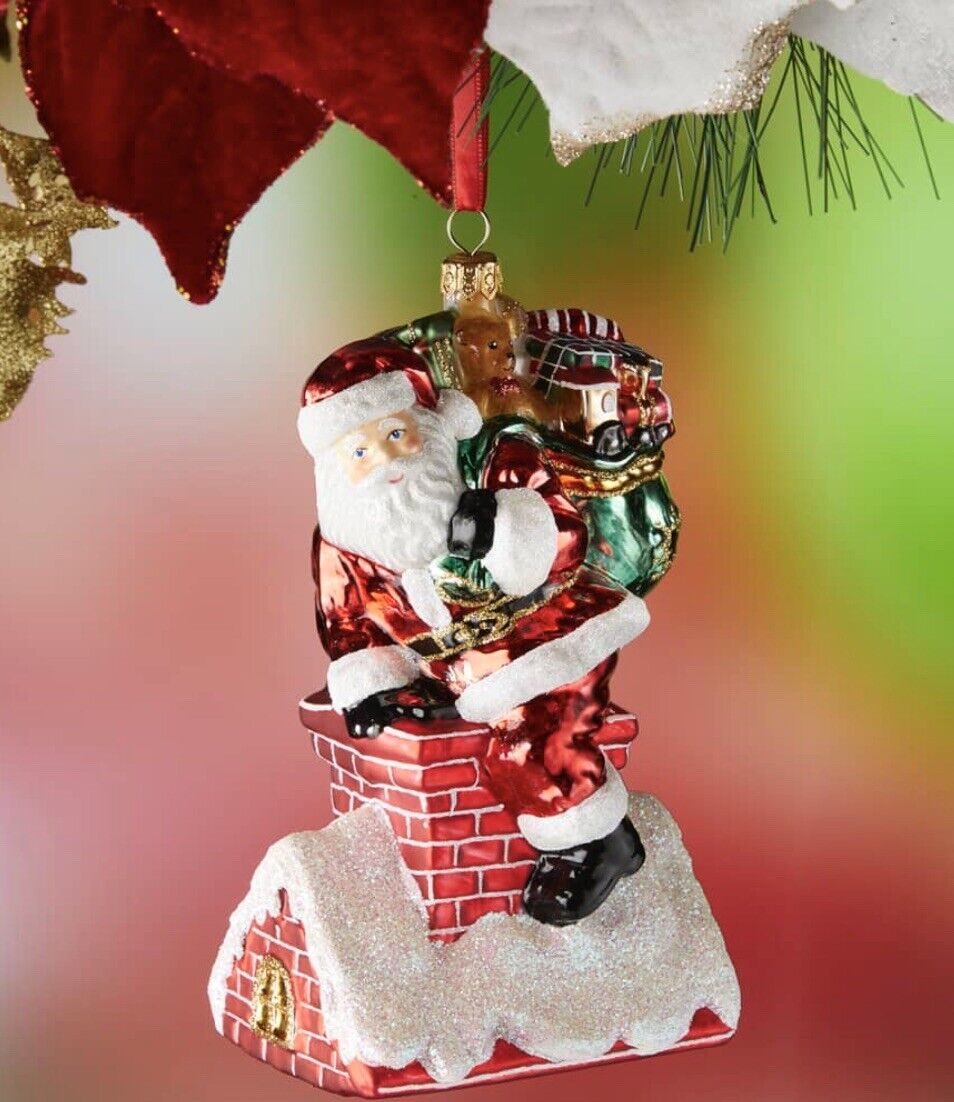New Neiman Marcus Santa carrying gift bag on chimney glass  Christmas Ornament