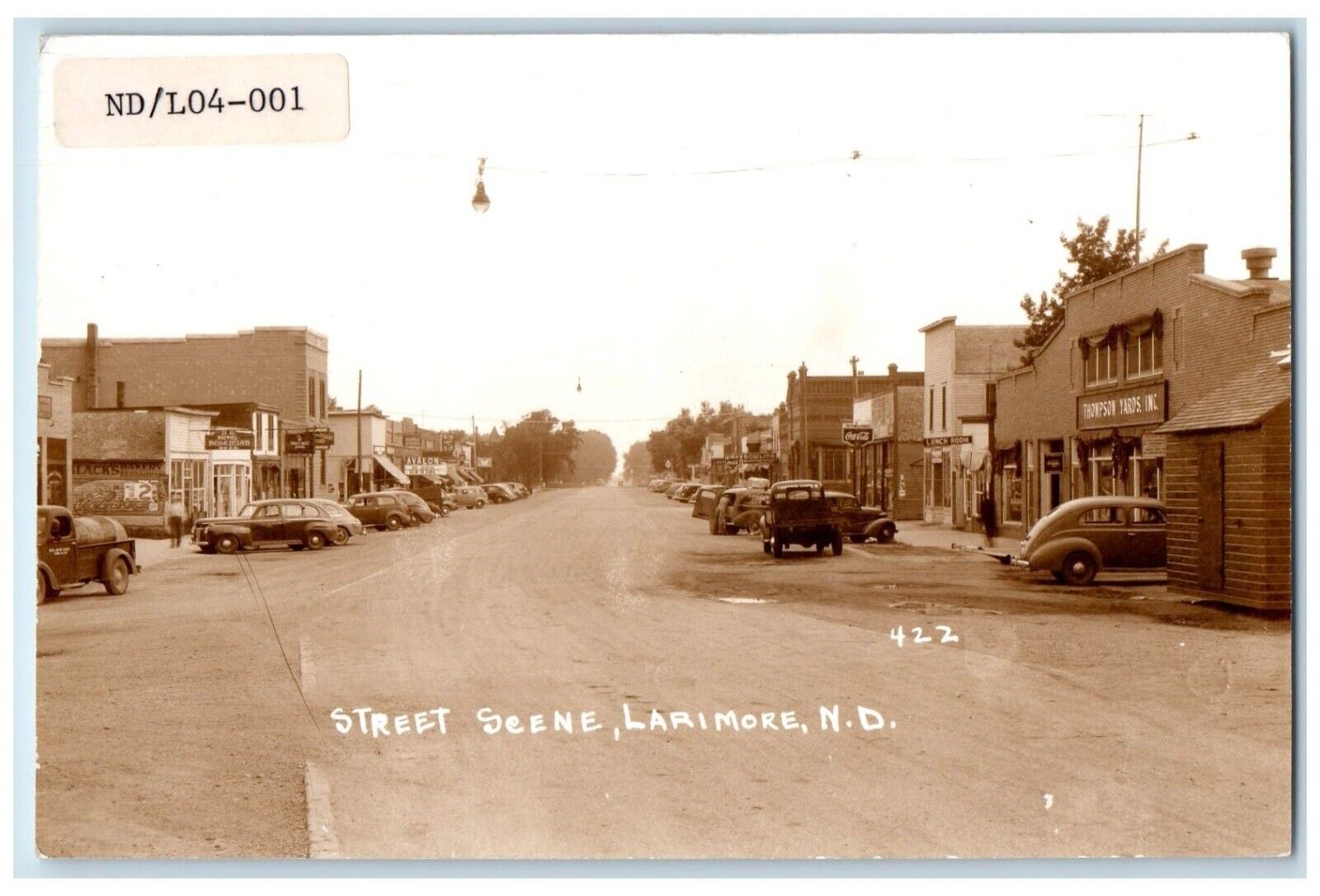 c1940\'s Street Scene Cars Coca Cola Larimore North Dakota ND RPPC Photo Postcard