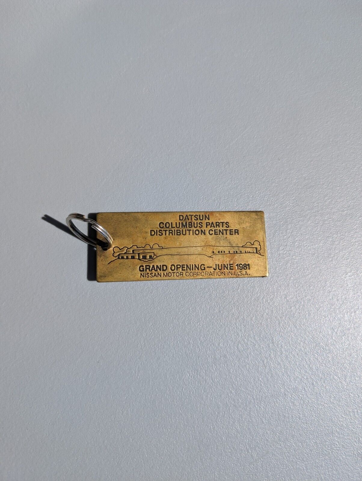 Vintage Rare Brass Keychain Datsun Columbus Parts Center Grand Opening 1981