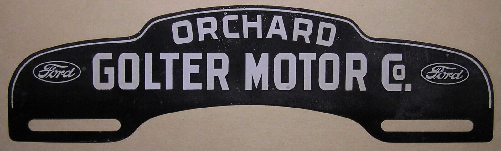 VINTAGE FORD ORCHARD GOLTER MOTOR CO ADVERTISING LICENSE PLATE TOPPER - NOS