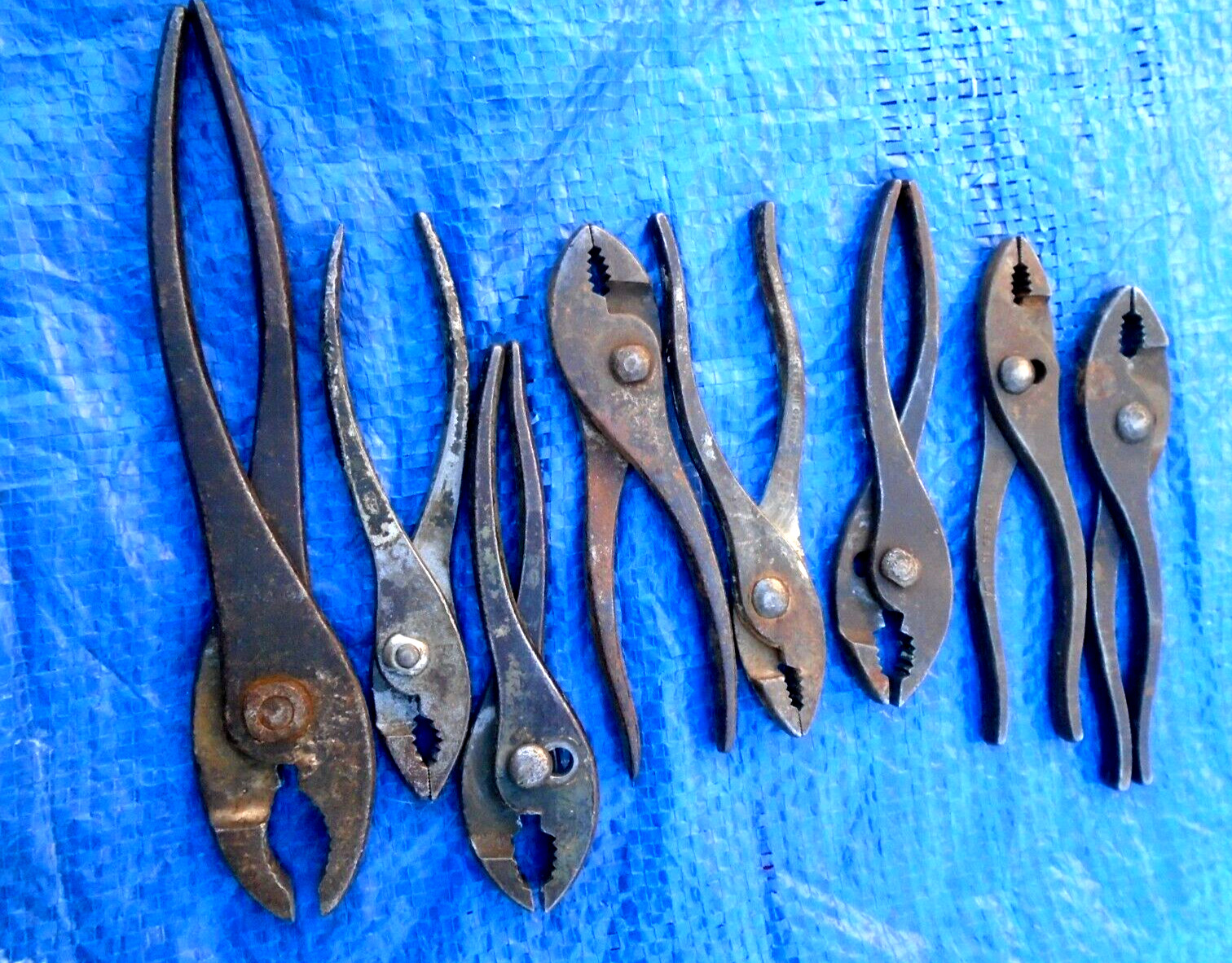 LOT OF VINTAGE PLYIERS (8) AN UNKOWN,FOR SQUARE BOLTS,NUTS