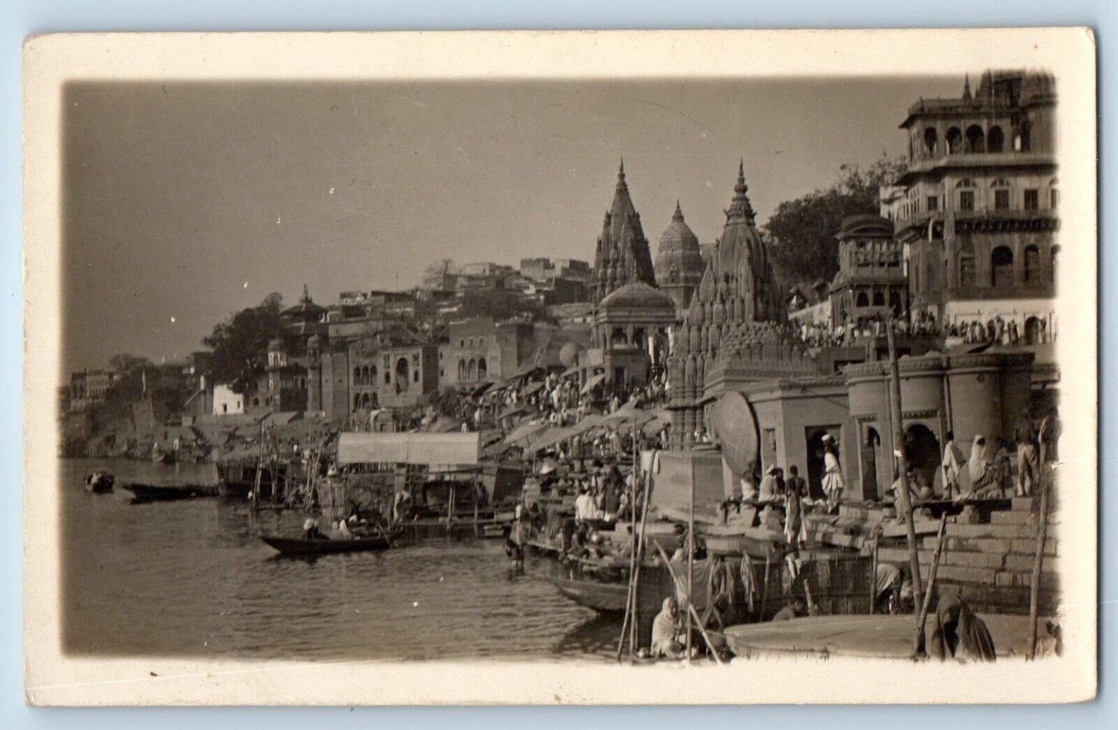 India RPPC Photo Postcard Boat Sailing Crowd Scene Near Varanasi Temple c1940's
