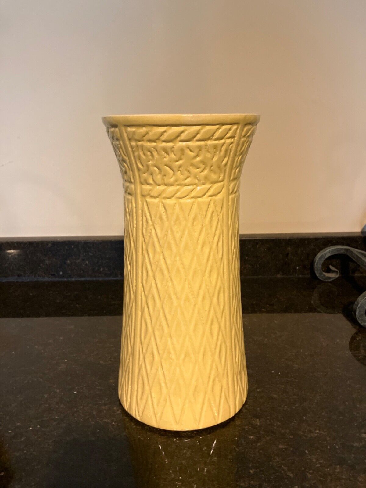 Antique tall yellow pottery vase 12.5” high with carvings