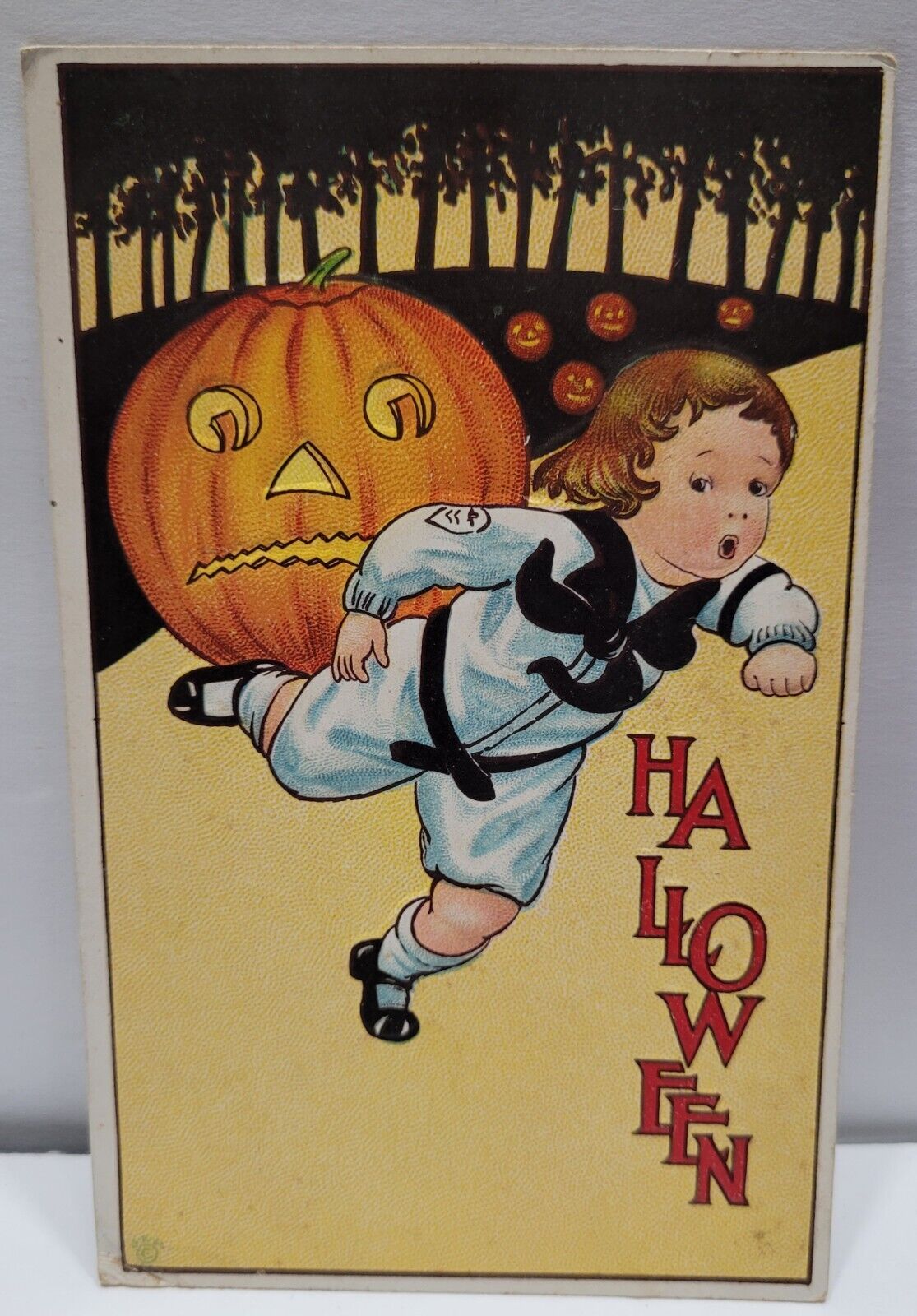 Vintage Postcard Embossed 1914 Halloween Boy Running From JOL Pumpkin Field.