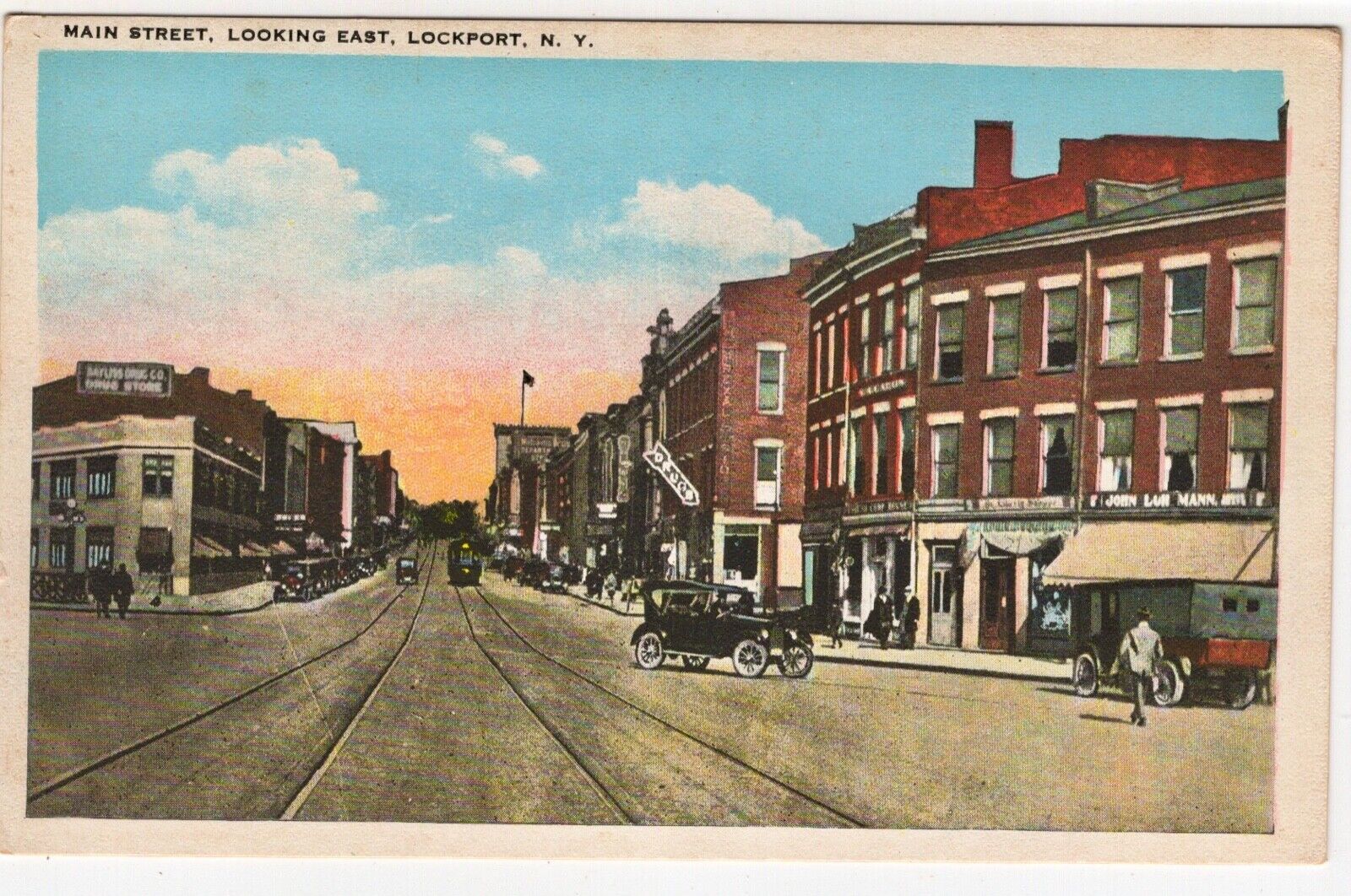 Lockport NY New York Vintage Postcard Main Street Scene Car Signs Stores Trolley