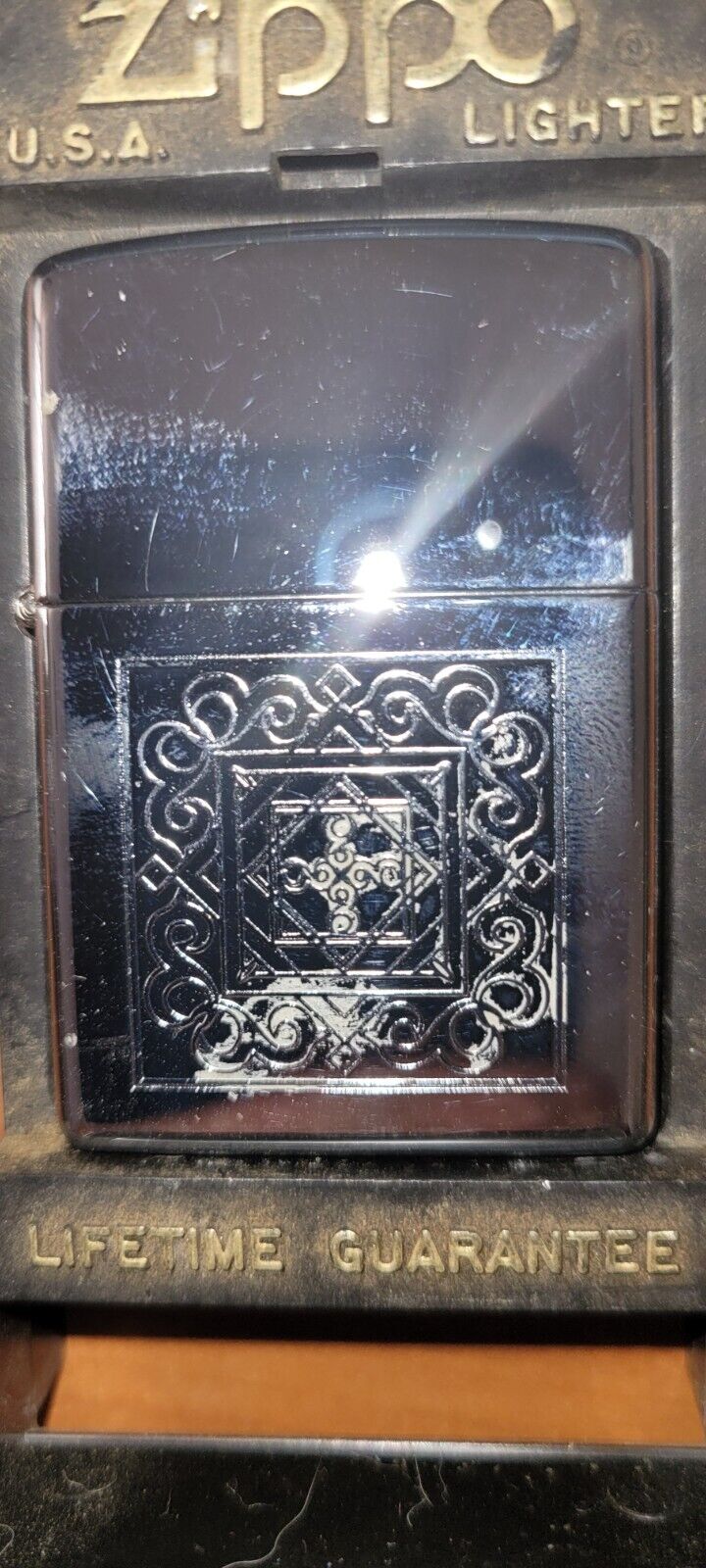 2000 XVI Zippo With etching of cross center inside of spiral designs