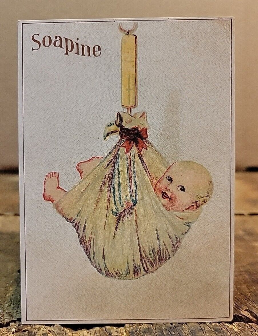 Soapine - Bundled Baby Suspended on Scale- Victorian Trade Card
