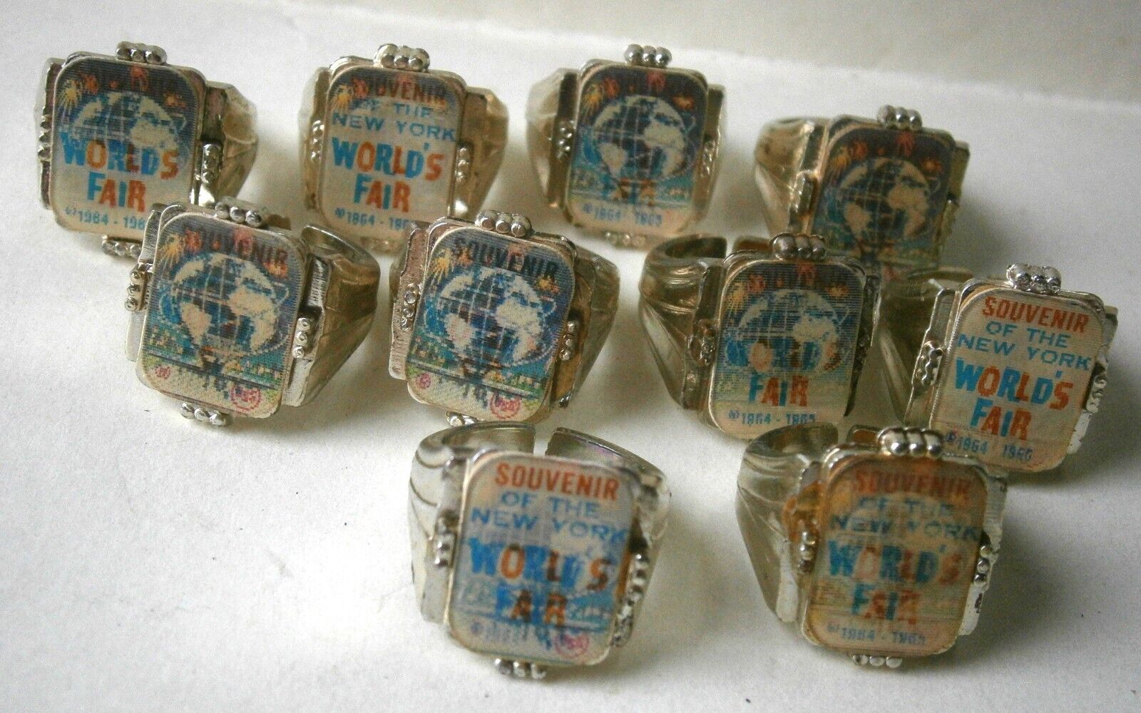 (10) 1964 - 1965 New York World's Fair Unisphere Souvenir Toy flicker Rings