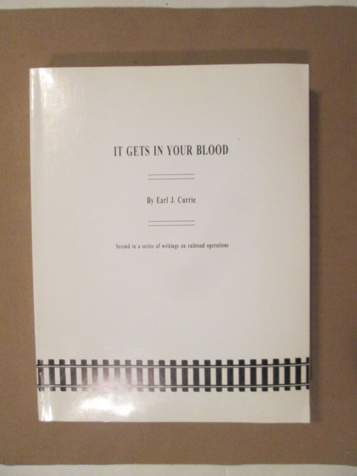 It Gets In Your Blood - Earl J. Currie - SIGNED