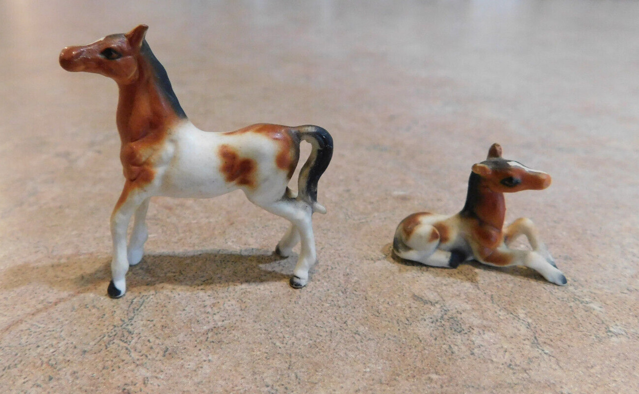 Pair of miniature bone china horses