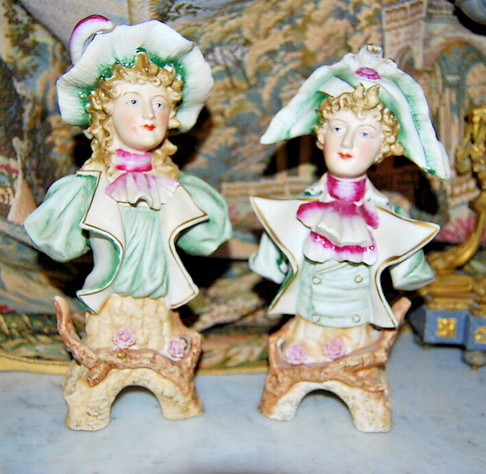 WONDERFUL PAIR OF HAND PAINTED BISQUE FIGURINE BUSTS IN TRADITIONAL PERIOD DRESS
