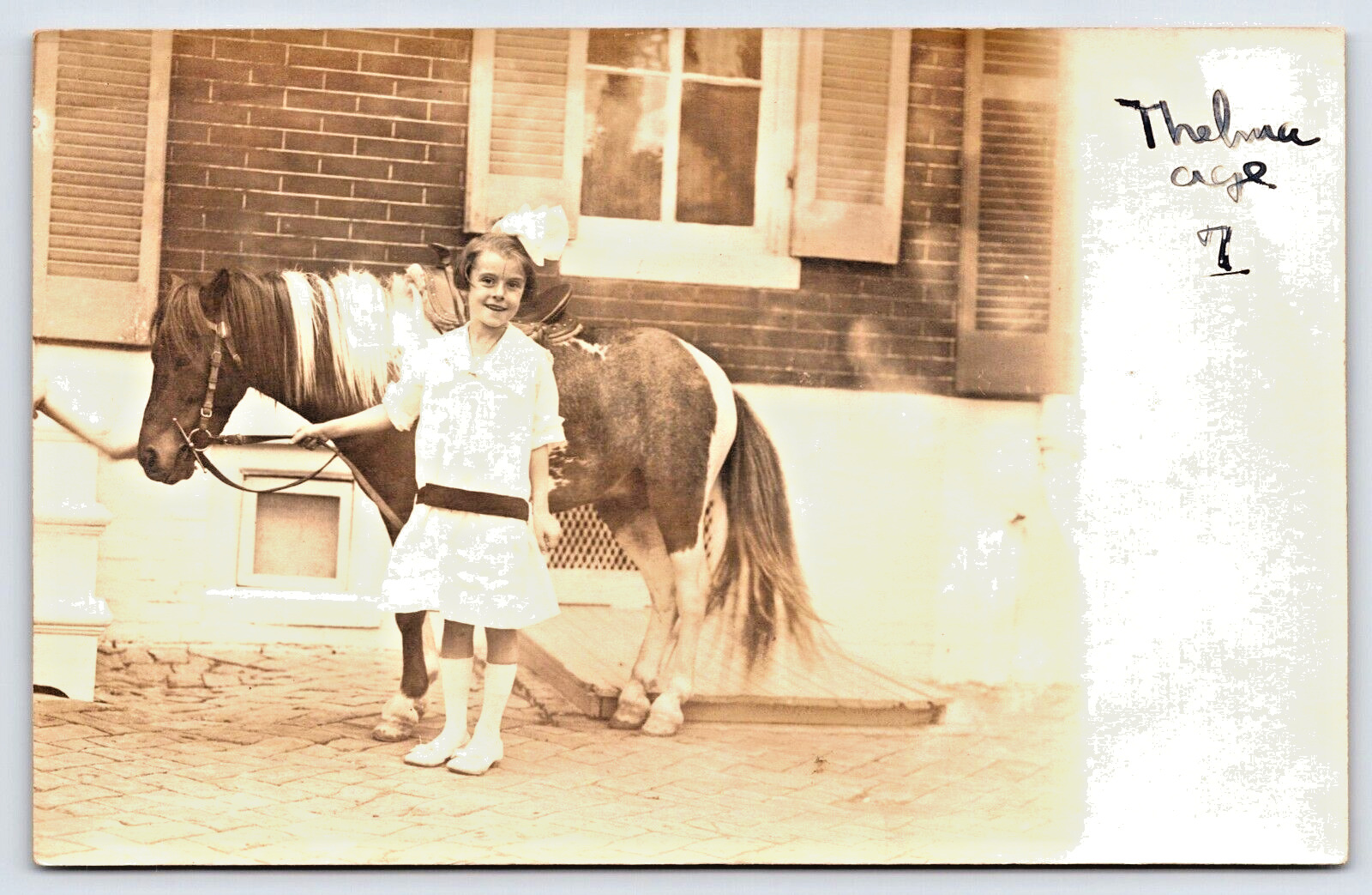 Postcard RPPC c1915 Thelma Smiling with her Paint Pony Age 7 Big Bow in Hair A13